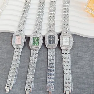 Detailed view of women's luxury rhinestone rectangular quartz watches with sparkling diamond straps.