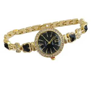 Gold tone women quartz watch with black dial rhinestone bezel and clover bracelet accessories
