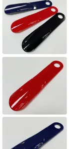 Plastic shoe horn detail close up view, colorful portable hanging shoe helper lifting tool.