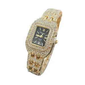 Detail shot of the luxurious square rhinestone women quartz watch with black dial and gold strap.