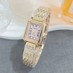 Elegant rectangular gold quartz watch for women with pink dial and Roman numerals detail.