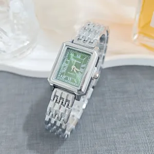 Elegant square quartz women watch with green roman numeral dial and metallic bracelet for daily wear.
