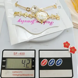 Goldene Strass Damen Uhr und Armband Set, elegante Mode Quarz Armbanduhr für Damen.