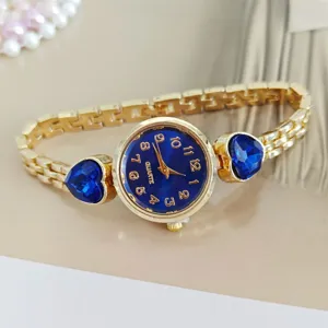 Fashion luxury women quartz watch with blue heart crystal stones and elegant gold metal chain band.