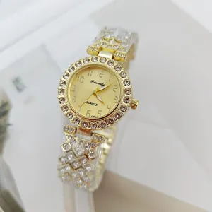Gold rhinestone women quartz watch detail shot featuring crystal bezel and crystal bracelet band.