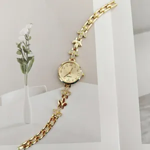 Elegante goldene Damen Quarzuhr mit Strass Weizenblatt Armband und Blumen Zifferblatt Alltag.