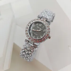 Luxury rhinestone quartz watch for women with sparkling crystal dial and elegant bracelet strap.
