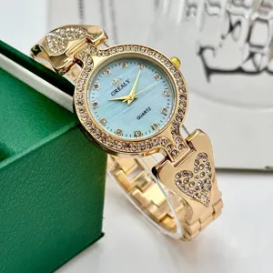 Exquisito reloj de cuarzo con pedrería para mujer y elegante diseño de pulsera de corazón.