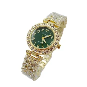 Luxury green dial women quartz watch with dazzling rhinestones and gold bracelet design.