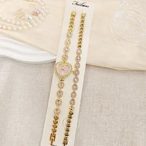 Luxus Strass Herz Quarz Uhr Set mit passenden Tropfen Armband für Damen Eleganz.