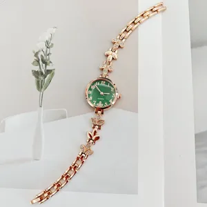Elegante roségoldene Damenuhr Quarz mit grünem Zifferblatt und Strass Weizen Armband.