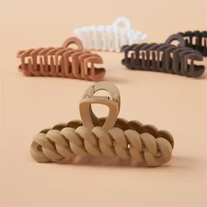 Matte chain hair claw clip detail showcasing elegant braided design, neutral tones for daily secure hairstyles.