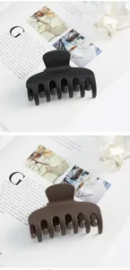 Matte large hair claw clips in black and brown, vintage minimalist style hair accessories.