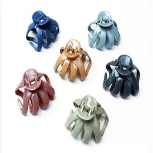 Detailed view of colorful plastic octopus hair claws set, stylish hair accessories for women.