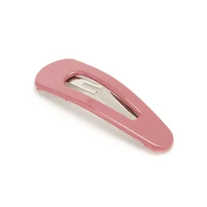 Close-up detail of the pink metallic snap hair clip showcasing smooth glossy paint finish.