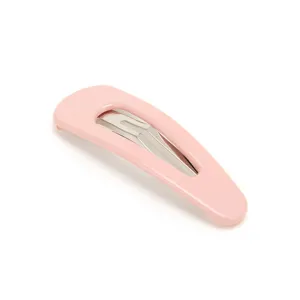 Pink snap hair clip detail shot, minimalist metal hair accessory for daily styling and women.