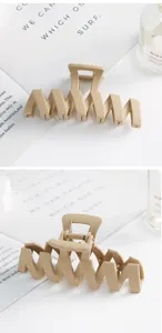 Matte geometric hair claw clip in beige, large size trendy hairpin for elegant styling details.