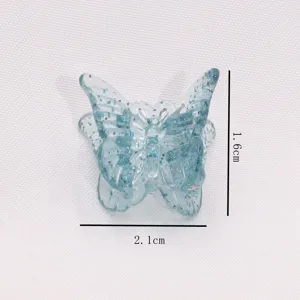 Mini blue glitter butterfly hair claw clip, cute transparent acrylic hair accessory.