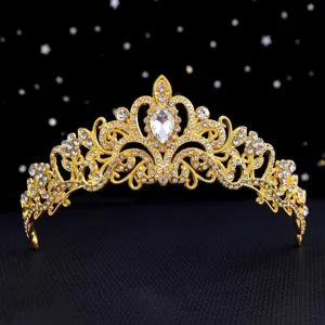 Close-up detail of the glittering gold tiara, showcasing intricate rhinestones and design.