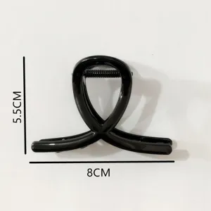 Black geometric hair claw clip for women, stylish shark clip for elegant updos and hairstyles.
