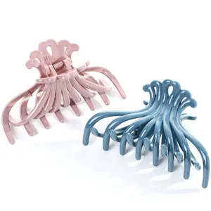 Large plastic hair claw clip for women, stylish wave design hair accessory, strong hold grip.