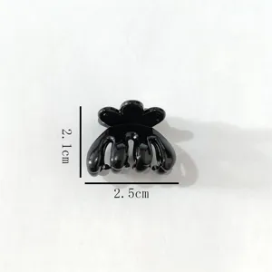 Black plastic mini hair claw clip detail shot, perfect for styling bangs and daily updos.