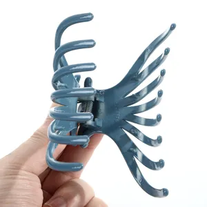 Large plastic hair claw clip in blue grey, sturdy ABS material with strong grip for daily styling.