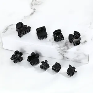 Assorted black plastic mini hair claws set, cute flower and bow hair clips for daily styling and bangs.