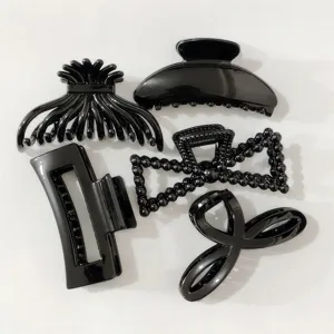 Set of 5 glossy black hair claw clips, trendy minimalist hair accessories for women.
