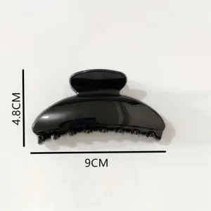 Minimalist black plastic hair claw clip for women, sleek design daily hair accessories