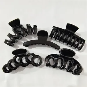 Detail view of 5 pieces glossy black hair claw clips set for thick hair styling