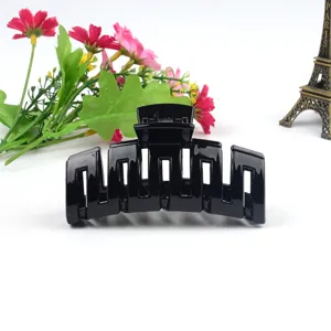 Large black plastic hair claw clip for thick hair, classic geometric hollow design for daily use.