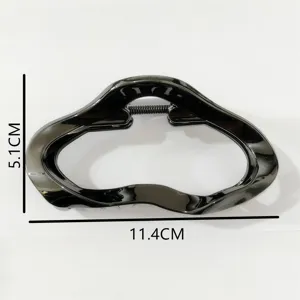 Glossy black large hair claw clip for women, stylish geometric hairpin for thick hair updo.
