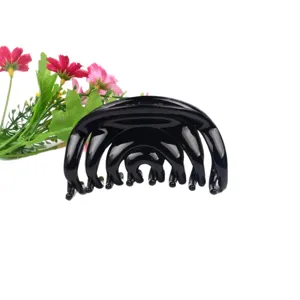 Large black plastic hair claw clip for women, stylish minimalist styling hair accessory for daily use.