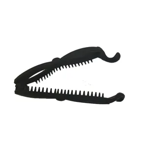 Close-up detail of a black plastic banana hair clip with teeth design, stylish and minimalist.