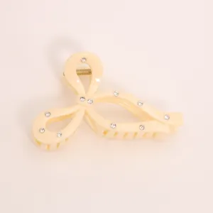 Elegant bow hair claw clip with sparkling rhinestones, minimalist resin shark clip for women.