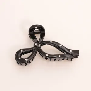 Black rhinestone hair claw clip minimalist elegant butterfly shark clip detail view