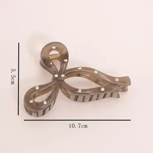 Brown rhinestone bow hair claw clip detail, elegant crystal acrylic hair clamp for women.