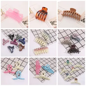 Stylish multi-color plastic hair claw clips set, elegant geometric hair accessories.