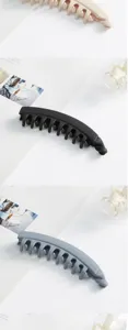 Retro minimalist banana hair clip with jagged vertical design, stylish accessories.