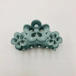 Light blue flower ABS hair claw clip, stylish glossy hair accessories for women daily styling.