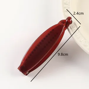 Wine red jelly banana hair clip detail, stylish minimalist hair accessory, 9.8cm length.