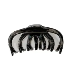 Glossy black hair claw clip for women, French minimalist style, elegant versatile hair accessory.