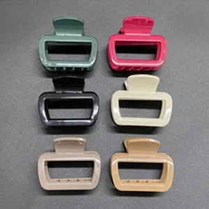 Glossy hair claw clips detail shot, minimalist solid color hair accessories for daily hairstyles.