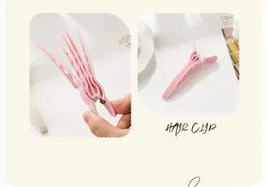 Detailed view of the root volume hair clip, showcasing multi-prong design for styling bangs.