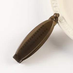 Brown translucent hair clip detail shot, minimalist design, stylish retro hair accessory.