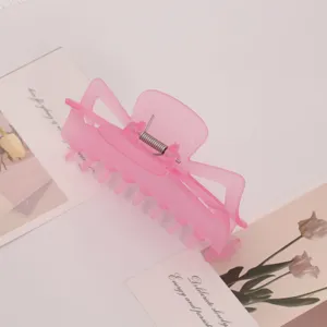 Pink frosted plastic hair claw clip, minimalist Korean style hair accessory for women daily styling.