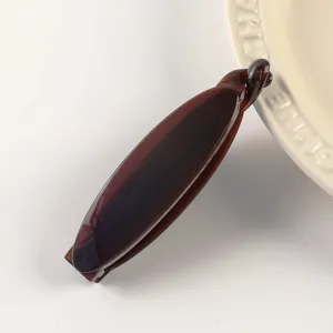 Dark brown tortoiseshell banana hair clip detail, minimalist elegant hair accessory for women.