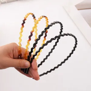 Detailed view of wavy rhinestone headbands with teeth anti-slip design, tortoise and black styles.
