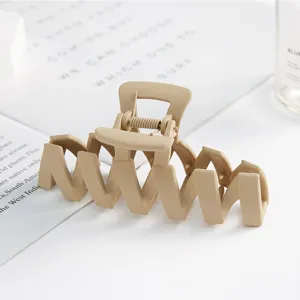 Minimalist matte plastic hair claw clip, large geometric shark clip for daily elegant styling.